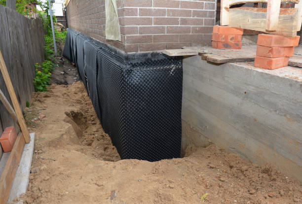SJ Waterproofing Pros technician performing targeted Waterproofing assessment in Hampshire, TN